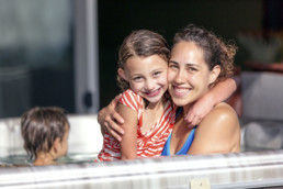 Family enjoying spa pool, mum daughter and son